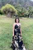 I purchased this dress for a wedding in Hawaii. I ordered a small and a medium but ultimately kept the small because the print in the medium, which fit better, had a flower somewhere I didn't like. The small would not zip up all the way, so I had the dress tailored to let it out. I also had it altered to be taken up (it's super long); the neckline closed slightly and cups added in. The dress was definitely perfect for the venue, and I loved wearing it! - Morgan M.