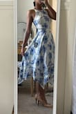 I absolutely love this dress very cute, it does bunch in the back b/c the slip is sewn into the dress and the zipper. The slip underneath is short and form fitting, not flowing like the dress - Kori H.