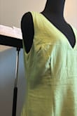 I absolutely LOVE almost everything about this dress. The color is vibrant; the back is elegant; the form is fitted but not TOO fitted/club-like. My issue is with the bust area - specifically the seams/darts. I admit that I overlooked the model photos, which was a mistake, but the "darts" are set way lower and wider than the majority of the female population's anatomy. The body goes one way (more straight ahead), yet the tailoring goes way sidewards. This does not align even close to my body and it doesn't look right. Any photos of this dress on me are too cringy, so here is a photo of it on my dress form (Size 4, for reference). Please note that while the dress is not ironed in the photos, ironing does NOT fix the issue - Savannah H.