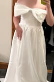I was obsessed with the photo online and thought it would be perfect for my bridal shower. It was a nice quality, but too long for me and would have needed alterations. Then the bow was not sewed onto the dress and poked out so that was a bit odd. - Jamie W.