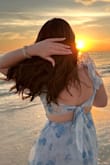 I couldn't get over how gorgeous this dress is in general but you throw it on in front of the ocean and man does she pop! Absolutely such a gorgeous and flowy dress. I was in temps of 111 and she's so light weight I was so cool and comfortable! - Casey L.