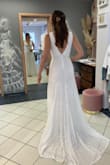 This is the dress I chose for my wedding! It was indeed larger on top so I got an XS. The size down is a tad snug in the waist, and I still had to get the top fitted. I'm wearing a deep cut bra that i got on amazon to get the boob pop that is on the model photo. Overall I'm really happy with how it turned out. The seamstress also added a clip to hang the train (does not come with the dress). Perfect for my simple forest wedding. - Kristina C.