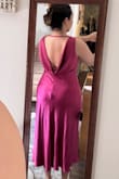 I love this dress, but it needed altering for me. I'm shorter at 5'2 with a short torso and average-sized chest, so the straps were too long and needed adjusting. My hips are wide, and the medium was a little tighter around the mid section than I'd like, but it worked out with spanks-HOWEVER, the low back made it difficult as the spanks kept showing. It would probably fit better on a different shape. The color is gorgeous and I'd describe it as magenta. - Jennifer W.