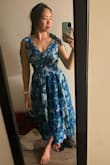 I bought this dress to wear at a floral-themed wedding and was disappointed with the fit of the dress. I loved the pattern on the dress, very beautiful and quite original! I normally dress in an S size but bought an M size, as it was out-of-stock in my normal size: I expected it to be too big, and it was, so it is true to size IMO. Besides my self-inflicted size issue, I found that it had a weird fit. As a small chested person, I felt that the criss cross created a lot of volume under the chest around the stomach area, but the criss cross would reveal my underboob line if I had a bigger chest, so I would say it is unflattering for most body types. The dress is also voluminous under the waist belt, so the dress made me look bigger than I am. Lastly - not a problem for me, but you can't wear a bra under this dress. - Aurelie W.
