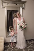 We planned a last minute wedding to Vegas for the month of June and wanted something elegant, simple, yet tasteful, with a little bling, but not overwhelming. I am the type who loves unique items that aren't like everything else, and this dress was absolutely stunning and perfect for my wedding dress. We were married at Caesar's Palace and I didn't want something that would be heavy and hot, and this was perfect and extremely comfortable! I did pay to alter it slightly around the chest and stomach area, but it still looked great even if I hadn't taken it in an inch. We walked around after our wedding and received SOOOO many compliments, felt like a queen! Highly recommend this dress and the shoes were the perfect fit and accessory! Thank you so much for this beautiful dress to make our day even more special!! - Patrick C.