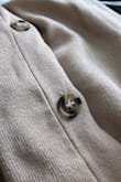 For the price, I expected better quality. The stitching of the front pocket was coming undone and there were single threads popping out in the stitching. The button holes look like the thread was unraveling. I'm returning. - Brianna G.