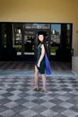 I bought this for my graduation and it ate. I stuck with a size XS since I wanted it to fit snug. It was tight but it has a bit of stretch to it. I could have sized up but I think it would have been lose in the top area. - Marie M.