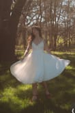 I own this in black and white and it's stunning! The skirt is so full and just flows out when you spin! The material is great quality and the dress is lined! - Elizabeth W.