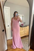 Beautiful dress with a thicker material. Straps are adjustable for length. I did have to get the dress hemmed because it was too long (I'm 5'2") and now it is perfect. The pictures show the dress hemmed and before when it was long for reference. - Nicole M.