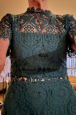 This lacy beauty is beautiful in deep forest green. It brings the nuance of elegance to the wearer. I am 68 and feel 48 in it! Never one to bare my belly; this dress discreetly allows it and I love it! - MARY W.