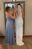 Everyone went crazy over my dress on my wedding day. It was conservative, form fitting, form fitting but not tight. The beading made it so I didn't have to worry about it wrinkling. - Molly R.