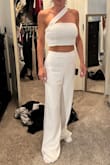 This is my 12th white outfit! I have a white party to attend and I could not find any fabric or style in white that I liked. Once I received this and tried it on, I was thrilled. The outfit is double-lined so it is not see-through. I tried the outfit on with red underwear and you could not see them through the fabric. The pants are long but I feel all Lulu pants/jumpers are always too long for me. Fabric is soft and very comfortable. The pants are a little loose but I like the look. I wouldn't want them tight, not in white. Would love to get this outfit in black. - Tara A.