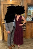 The dress is beautiful and 10/10 comfortable. However, it is a tad big so if you're between sizes, I would recommend sizing down. I ordered a S and should have gotten XS. The V neck is very deep and I had some gaping. The arm holes were also a bit large (all due to the dress being a tad large). - Genevieve C.