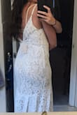 Very lightweight dress! I'm planning on wearing it for my honeymoon rather than my wedding. I couldn't zip it by myself so the top is a little loose. - Autumn P.