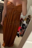 This is me trying it on quick out of the bag, it's not even all the way zipped. I like it a lot. The color is different, elegant looking. The orange is much darker than the picture online. Overall, it's a great dress. I plan on wearing it for a fall wedding. I'm wearing a 34c bra and I'd say I can just about get it zipped. It's snug. - Jenna S.