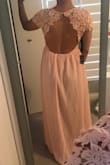 I originally ordered this dress in a small (see pictured) and it was a little big. I returned and ordered an XS and it wouldn't zip up. I returned the XS and ended up getting the small again. I will likely just alter it. It's a great dress. High quality, great color, exactly as pictured. It's high quality, especially the lace. - Tammy T.