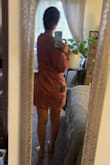 I was worried this was going to be too short for my taste, but it really wasn't. This dress runs a little bigger up top but still works for me. The fabric is beautiful and it has a teeny bit of shine to it. I am 5'8, 140lbs - normally about a size 6, and I purchased a medium. I might have been able to size down, but then it probably would be too short! Love it the way it is! - Rachel M.