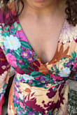 Just as advertised. Really unique, very light fabric it fits very well since there are string you can make it more snuggly or more loose. I wore it to a wedding. I have small boobs and it was a little loose on the top  and I got the smaller sizer but a safety pin fixed. I am short 5'2'' and length was perfect with 3inch heels. - MARIANA L.