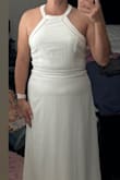 I love halter dresses and wanted to love this dress. I bought it as an option for my bridal shower but ended up returning it. Most Lulus dresses I think are made for girls that are 5'5" and taller. It would be nice if the middle part of this dress had a bit more give at the waist. Doesn't look good if you have a slight belly as you can see in the photo. Made for smaller girls. I ordered a size large. - Marissa M.