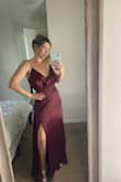 I got this and another dress and debating between the two to wear as a bridesmaid dress. The material is decent. It's a very light and airy dress and I really like that because I live in hot FL. The slit is very cute and not overly revealing. I'm not sure the top looks the best, but we'll see how it works out. Overall, I think it's a good dress! - Janine M.