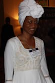 I wore this dress to a banquet with my headwrap and received so many compliments. I was told I looked like a an African Goddess, A Queen, a Woman of Elegance. All of which are  true! Haha! This dress is very, very long. The material is thick, sort of like a heavy sheet. I wore a white camisole underneath because i didn't want my chest out.  I really enjoyed this dress, it's definitely a statement peice. Can't wait to wear it again. As long as you have confidence in yourself you can rock anything!!!!! - Lakeisha H.