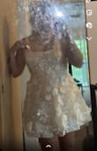 I was so excited to buy this dress but it's not exactly as pictured. The color is slightly off. It's really a nude dress with white appliqués over. The tulle and chiffon like materials feel so cheap they are not the most comfortable to wear either. I really wanted to love this dress. It might still work for my courthouse wedding but it's definitely not what I expected to be receiving. - Adeline T.