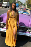 I wore this dress in Cuba and it fit right in with all the colors! The dress is gorgeous and it makes for a great photo op!! Definitely hang to dry because it did shrink up on me a bit and I have long legs. - Ashley A.