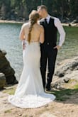 Wore this for my intimate wedding ceremony and I was so happy with the result! The straps on the back are easier to get positioned right with help but once the dress is on it's secure and looks amazing! I definitely could've used an extra inch or two to fully cover my heels but overall it was great for my wedding! - Hannah M.