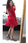Love the red fabric with the star embroidery! The backless ruffle detail is my fav! Such a fun & tastefully sexy dress. I'm so short and petite so the hem is slightly above my knee. Which is perfect for me! The arms are pretty stiff so I wouldn't recommend crazily moving your arms up and down lol! Or I could see it ripping for sure. Perfect for date night or girls night out or church! - Marielle N.