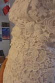 Has a weird fit in the back with the lace pattern. It feels too loose. There is also a button up top which is always annoying to hook in any dress. The fit on the waist/hips is really nice but the chest area was too big for me (28B size). It also is a very rough material, the lace isn't soft. It's very thick and made of thick thread so it's not the most silky and soft to wear and when bending a little bit or even walking or raising your arms, it does a weird pokey triangle thing that you can see in my second picture.

I returned this. - RISHITA P.