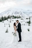 I had gotten this dress for our epic elopement in the mountains and it was perfect. I wanted something simple yet unique to highlight my petite frame. The dress itself is overall covered with lace with clear crystals scattered throughout. The back is the statement of the dress. It's a cross-tie style with a veil-like train from your waist that gives it a wow factor. - Angela S.