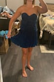 I like this dress a lot! The detailing is super flattering for the waist and the fabric is fun, soft and shiny. Great little party dress! - Kelsey W.