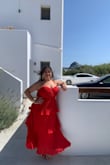 The dress fit so comfortably and well. Did not have to alter length. Traveled to Greece with it in my luggage, and it did not damage the pleats. The bright red color is so beautiful and matches perfectly with gold accessories. Even after removing my three inch heels, the dress did not drag on the floor. Can't wait to wear it again. The zipper is a real pain sometimes - it closed perfectly (the dress was not snug). Sometimes and other times, the zipper would drag and tug on little fibers popping out. The price is worth the zipper issue though. Definitely worth getting - got so many compliments on it! - Angelica M.