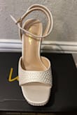 I bought these to wear for my wedding day! I'm usually a 6.5-7, size 6 fit me just right. Perfect since my fiancé is a lot taller than me and these heels are instantly comfortable! My dress has pearls on them so I love that they aren't a true white and the pearls are a nice touch. The price is better than most I found similar, can't wait to wear them with my second dress too! - Nikki C.