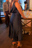 Very pretty dress, the back needs to be folded out though to look cuter. Material is very nice and felt comfortable all day :) I'm also a short gal but the length of this dress was just right and didn't need any hemming. - Grace K.