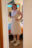 I bought this dress during my long search for a dress for my wedding reception. I was pleased with the quality of this dress. The lace is made out of comfortable, not scratchy, fabric yet feels sturdy enough to withstand dancing. The dress features a layer of crinkly light-weight plastic mesh between the liner and the lace to add volume. That is a nice touch. I dress was tight for me around my breasts, but that wasn't surprising given my cup size and my "barrel chest." I bough this dress on final sale, so I'm keeping it, but I won't be wearing it at my wedding because it just felt too casual even for the reception and just didn't make me feel like a bride. - Allison B.
