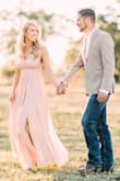 This dress was perfect for my engagement pictures! I loved the length-I was able to wear my heels with it without it becoming too short. With 4 inch heels, the hem just brushed the ground. The slit was not "too much" for pictures. As I am a bustier girl, I cannot pull off low-cut outfits without looking a little...too sexy. I put a tack (small stitch) on the front of the dress to pull it closed so that I could wear a sticky bra underneath it. This worked perfectly! I typically vary between small and medium, but for this dress the small fit perfectly. The pictures were taken by Luke and Cat Photography. - Jana K.