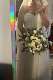 Dress runs true to size. Close up photo to show the lace detail. Perfect amount of poof. I will be wearing heels and it floats on top of the floor with the heels. Would be a hair too long in flat shoes. - Cierra S.