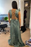 Beautiful fabric and "X" back. Love the pleats- very stylish and elegant but I am so DISAPPOINTED! The length is way too long and the bust is too large. I was hoping that this dress would fit and I knew from the reviews that it runs long, however, I did not realize just how long it truly would be. I am 5' 3" on a good day, and the longest part of the dress was 12" too long. The shortest part of the dress was 8" too long. The bust was unfortunately a BUST since it was meant for someone way more endowed than I ever will be. The waist was tight on me, and it didn't want to zip up fully, but I did manage... eventually. A good tailor could make the fixes I would need, however, I do not have the time nor money to do this before the wedding I am about to be a part of. I will be RETURNING, sadly. If you can sew difficult fabrics that are uneven, then you may take on this challenge. The pleats just make it hard. Just beware of the length and if you do not have a large chest, this dress probably is not for you. - Lia S.