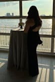 I wore this to my friends wedding and got tons of comments! I was in between sizes M and Large but I went with the L instead. If I wore M, it would've been too tight for my wider hips and thigh, slit would've been too high but was perfect for my chest. I stuck with Large- the top was slightly loose but barely noticeable and the bottom half was perfect. I did wear this without a bra and had petal covers to smooth out the chest area but if I had added silicone adhesives, Large would've been just right with no upper body looseness. Overall I still love this dress, and loved the open back! - Jessica C.