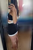 Its a super cute dress and style idea, but I'm 5'7" and it's pretty dangerously short on me, especially in the back! I feel like so many of lulus mini styles just need to be 2 inches longer for anyone about 5'4"!

For shorter ladies, I say go for it, though! I'm usually between an XS and a S in lulus, and for this one I'd say you could probably do either, it just depends on how you want the skirt to fit - Ariana R.