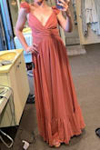 The material feels nice and heavy so it hangs nicely but breathes well. The color is fabulous. The detail on the shoulders is fabulous and not even very wrinkled at all! Hoping to not have to iron it before the wedding after traveling with it in my suitcase. Will probably just hang it in the bathroom while I shower to smooth it out. The length is a tad long but perfect with heels on! I'm relatively tall so might be too long on some - Natalie P.