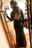 I had to get it taken in and hemmed but I got so many compliments! I loved the open back but it's still very elegant. - Sarah W.