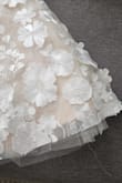 I ordered this dress to be my reception dress for my destination wedding. While it is cute, unfortunately the quality was quite poor. There were lace details in the back that looked like it had been ripped off, some of the flowers were barely hanging on and the crinoline underneath was not evenly cut (stuck out from under dress in some spots but not all around the dress). Also, the nude lining was much more yellow in person than anticipated. For the price, it was not worth it sadly. - Danielle C.