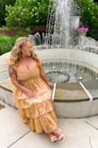 I loved loved this dress for a wedding I attended. The fabric is sparkly in the sun. Dress fits true to size and you tie the straps so you can control how tight or loose they are. The ruffles are just perfect! They twirled around on the dance floor. - Marissa B.