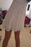 I bought this as potentially something to wear for my court marriage wedding day and... holy crap. I couldn't tell from the photos I guess, but IT'S SO SHORT. Like, it should be lingerie type short. I was laughing so hard, I couldn't believe it. It fits amazing (5'3, 28B size) but holy crap if I bend over even slightly, it shows my underwear. It's incredibly short and not appropriate at all lol. I will be keeping this to use as lingerie (although it's lacy and would be kinda uncomfortable to wear to bed, despite being soft) but my fiance loves it! - RISHITA P.