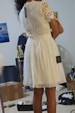 To start, I'm 5'3 and 28B, and the chest area for the XS size was too big. It kinda protrudes when you bend over a little or raise your arms for example. It's also just kind of ugly in general, even if it did fit well. I couldn't tell from the pictures but trying it on, the bottom part sort of "poofs" out a little and it makes the waist/hips not look flattering. The lace on the back and top is pretty but, well it didn't fit so. - RISHITA P.