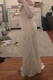 This dress is really cute. The material is not thick enough to suck in to compliment curves. In these pictures, I'm wearing a very good set of shapewear. Just wanted to offer a realistic picture- 5'5, 200lbs, ordered an XL - Lauren G.