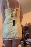 Definitely super cute but you can tell it's cheaply made. About a dozen sequins had fallen off between opening it and actually trying it on and the fabric of the lining just feels cheap. Same feel as the strings it's laced up with in the back. Definitely a bit short too. I'm between xs and s but went up to the small and so glad I did or I would be flashing everyone. I really like it but definitely don't think it's worth the price especially if you want to wear this to an event (this is just for my birthday so I'm not super picky about it) - Morgan S.