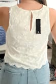 Very cute. Looks good with jeans. Good material not see through! Was worried bout this with the white but it is perfect! - Alethea C.